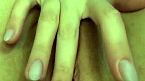 Girl pleases herself in close-up, put through fingers