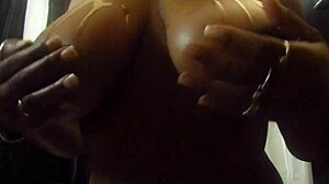 oiled chocolate ebony body shines under the light