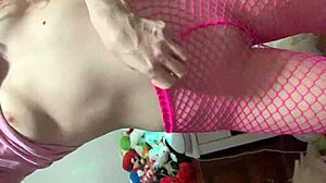 Beautiful Young Girl Performs Striptease in Pink Outfit