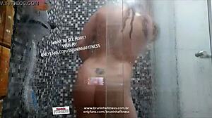 Naughty beauty bathes, plays with big black cock, inserts dildo in ass.