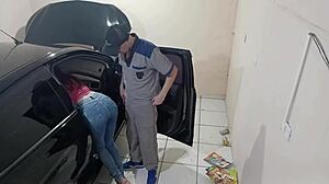 Employee Fixes Car in Workshop