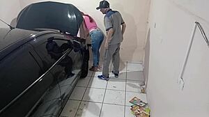 Employee Fixes Car in Workshop