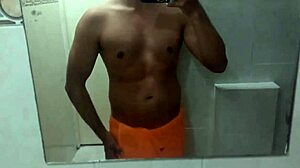 Athletic swinger poses in bathroom, dances striptease, masturbates to erection