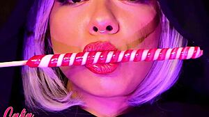 Enjoying a lollipop in a playful manner