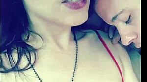 In the garage, a sexy couple engages in outdoor titty licking with glasses on, sucking and licking boobs topless