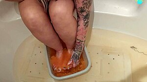blonde milf with natural tits and big ass performs solo feet sploshing fetish.