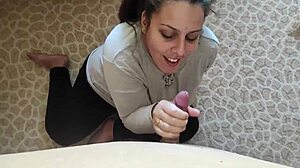 Wife cheats on husband by sucking stranger's cock through gloryhole.