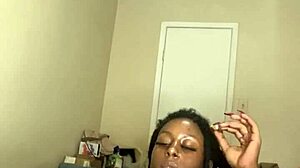 Ebony MILF makes her self cum using dildo and takes a cigarrte