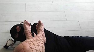 Check out her feet under fishnet stockings