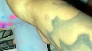 Ebony slut stuffs her pierced pussy with a pretty dildo in solo masturbation session