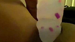Ebony slut stuffs her pierced pussy with a pretty dildo in solo masturbation session