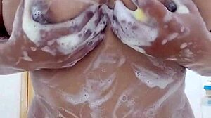 Sensual Filipina showers soaping big boobs in homemade video.
