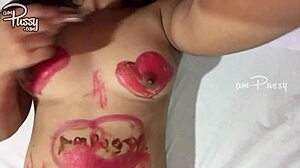 A teenage girl drew on her naked Asian body using lipsticks in a home video