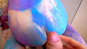 How does the petite 18+ teen get covered in colours and pleasured by her lover in the couple? Fucking bent over.