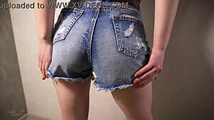 Teen playfully shows off her tight derriere in her denim shorts