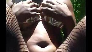 Hey, that masked girl is masturbating outside in lingerie.