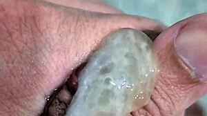 Watch the twink get a handjob and cum in the shower