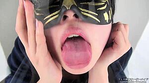 This asian girl in a tongue spit fetish video uses her saliva and tongue in a japanese style