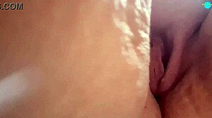 she spreads her shaved pussy for close-up play