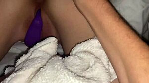 Hot chick intensely teasing shaved pussy with buttplug and toys