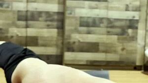 Muscular Bodybuilder Stretches Sensually