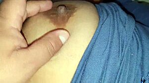 Squeezing my stepmom's big nipples while she moans