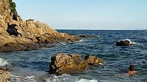 naked latina inserts pebbles on public beach!