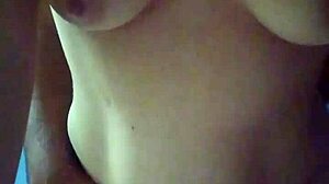 Young Couple Stands for Intimate Moment at Home