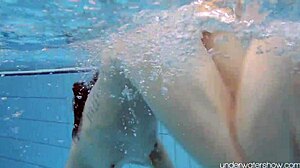 Roxalana Cheh shows off her sexy redhead body underwater, all shaved and ready.