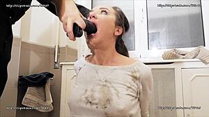 Nataly Gold performs extreme deepthroat with huge dildo in bondage