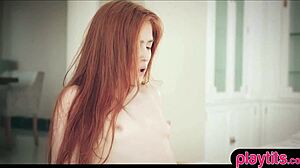 A real redhead teen engages in passionate lesbian sex with a brunette, exploring each other's bodies.