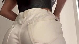 Wife Heyya changes clothes in shopping dressing room.