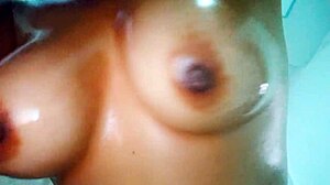 Skinny busty latina gets oil sprayed on tits and ass during massage