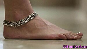 Babe gives intense footjob cumshot