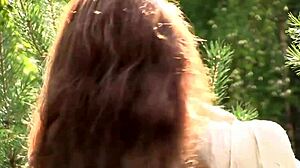 Nicole strips naked outdoors, embracing nature with open arms, amazing!