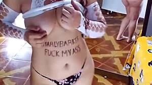 Undressing white sensual bodysuit and black panties.