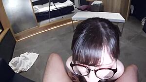 Beautiful woman in glasses in stockings in an Asian porn video