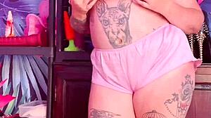 Teasing In Silk Pajamas With Huge Tattoo And Natural Tits