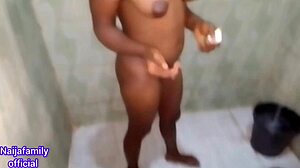 African teen takes homemade bath in family setting