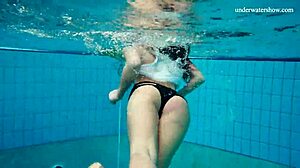 Horny teen gets naked fast by the pool, showing her tight pussy