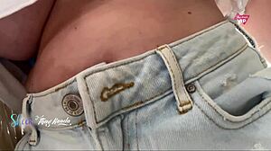 Hot wife flashes big tits while shopping without bra.