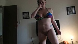 Close-up of brunette bathing, sucking big cock, cum on enormous natural tits