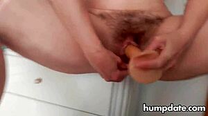 Hairy mature woman inserts two toys in pussy and squirts