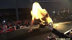 German stepmom strips naked on stage for wild public dancing. Her flexible moves stun the crowd.