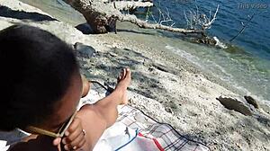 Excited wife sucking me on beach