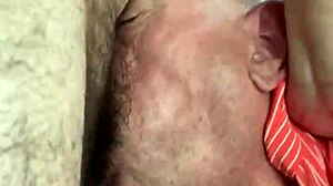 Watch him gagging on that hairy cock from behind