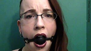 Dark lipstick ballgag drooling with intense eye contact