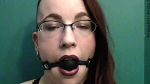 Dark lipstick ballgag drooling with intense eye contact