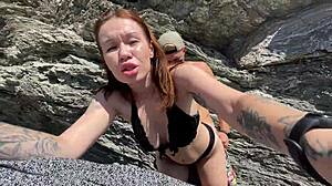 Hot brunette meets a stranger on a public beach.