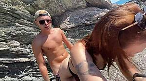 Hot brunette meets a stranger on a public beach.